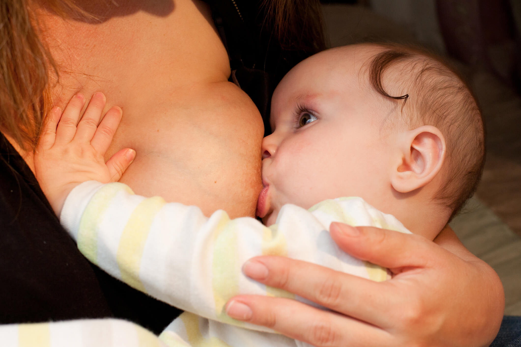 Close up of a baby breastfeeding