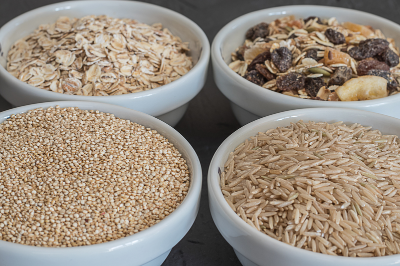 four bowls of different grains