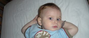 a baby wearing a medic alert bracelet