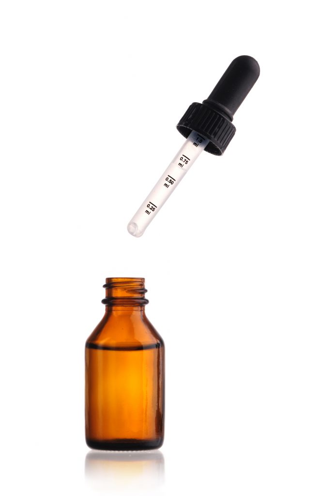 An amber vitamin d bottle and a dropper